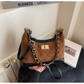 Detailed view of brown suede shoulder bag with diamond stitching and golden turn lock - Coffee