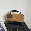 Detail of the brown suede and black quilted leather crossbody bag with gold turn-lock - Brown with Pendant