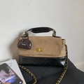 Detail of color-block quilted bag with gold twist lock and brand logo pendant - Khaki with Pendant