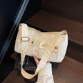 Versatile cream canvas crossbody bag featuring functional dual front pockets and brass snaps - Off White