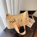 Chic beige utility shoulder bag with multiple flap pockets and adjustable strap - Khaki