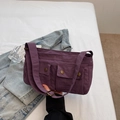Purple nylon crossbody bag with multi-pocket design and adjustable wide strap - Purple