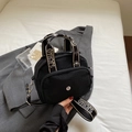 Black nylon crossbody bag with chic lettered strap and silver round metal logo charm - Black