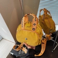 Bright yellow nylon crossbody square bag with wide patterned strap in mirror view - Yellow