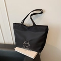Black canvas tote bag with white deer embroidery and smooth satin finish for women - Black
