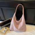 Detail of light pink suede hobo bag with large capacity in a professional office setting - Large / Pink