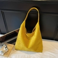 Large mustard yellow suede tote bag shown with office accessories on a minimal background - Yellow