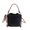 Black woven drawstring bucket bag with brown leather handle and beaded charm detail - Black