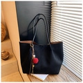 Detail of black suede tote bag featuring a colorful pom-pom and tassel pendant charm - Black (With Pendant)