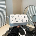 White faux leather crossbody bag with silver eyelet details and flap closure - White