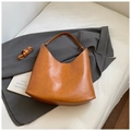 Caramel brown crescent shoulder bag in textured leather with wide strap and pendant - Brown No Pendant