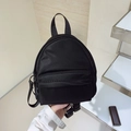 Mini black nylon backpack with front zipper pocket and adjustable shoulder straps - Black