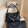 Black litchi grain leather tote bag with belt buckle detail and adjustable strap - Black