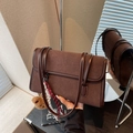 Minimalist dark brown suede shoulder bag with dual straps and a cute plush bear charm - Brown