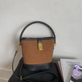 Sac seau bicolore marron et noir avec surpiqûres matelassées et fermoir doré - Marron