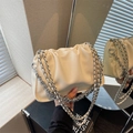 Chic beige pleated cloud bucket bag with silver metal chain and soft faux leather texture - Beige