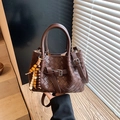 Dark brown hand-woven leather bucket bag with top handle and wooden bead charm accessory - Coffee with Pendant