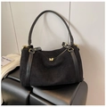 Dettaglio della borsa tote in pelle scamosciata nera con cerniere dorate eleganti - Nero