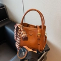 Brown leather bucket bag with decorative scarf and shoulder strap for women - Brown
