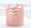 Pink laser-cut paper candle sleeve with snowflake and reindeer silhouette design - Pink