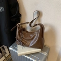 Vintage brown underarm bag in polished oil wax leather with decorative woven pendant - Brown with Pendant