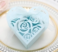 Macro shot of light blue heart-shaped hollow gift box with laser-cut rose patterns and ribbon - Pearl Pale Blue