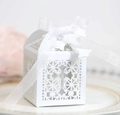 Detailed laser-cut white favor box with cross design and elegant organza ribbon - White