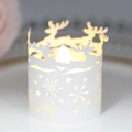 White Christmas elk LED candle holder featuring laser-cut snowflake and star patterns - White