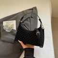 Black suede crescent bag with metallic studs and a slim adjustable shoulder strap - Black