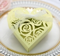 Macro detail of heart-shaped laser-cut gift box with floral patterns and ribbon - Light Green
