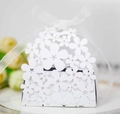 Elegant white laser-cut floral wedding favor box with a delicate white organza ribbon bow - White