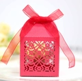 Detail of red hollow laser-cut wedding candy box with elegant ribbon bow - Pearlescent Red