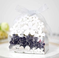 Macro detail of laser-cut floral pattern on silver metallic wedding candy gift box - Reflective Silver