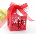 Detail of red hollow laser-cut wedding candy box with ribbon and thank you tag - Pearlescent Red