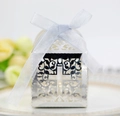 Detailed view of silver hollow gift box with cross pattern and blue organza ribbon - Reflective Silver