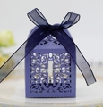 Detail of laser-cut purple favor box featuring hollow vine patterns and a cross symbol - Sapphire Blue