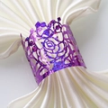 Close-up of purple glitter rose napkin ring with intricate laser-cut hollow pattern - Glitter Purple