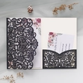 Close-up of laser-cut black glitter wedding invitation with floral insert and RSVP card - Dark Blue