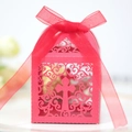 Red laser-cut gift box featuring an intricate cross design and a matching ribbon bow - Pearlescent Red