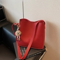 Vintage red bucket bag in litchi textured leather with cute brown fur ball charm - Red