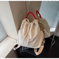 Detail of off-white canvas backpack with red woven handle and drawstring closure system - Off-white