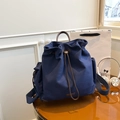 Minimalist navy blue canvas drawstring backpack with premium brown leather details - Blue