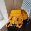 Minimalist yellow nylon backpack featuring a flap cover with black buckle closures and side pockets - Yellow