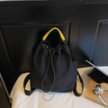 Black nylon backpack with yellow woven handle and drawstring closure for women - Black