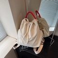 Off-white nylon drawstring backpack with vibrant red woven handles and adjustable straps - Off-white