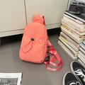 Coral orange pleated nylon chest bag with drawstring front pocket and adjustable strap - Watermelon red