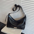 Minimalist black leather underarm bag with silver zipper and adjustable shoulder strap - Black