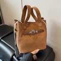 Caramel faux suede bucket bag featuring a brown leather strap and silver twist lock detail - Brown