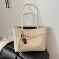 Chic cream woven leather tote bag with stylish charms and adjustable crossbody strap - Cream White With Pendant