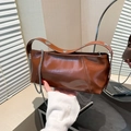 Brown leather handbag with metallic rivets and silver chain strap for autumn fashion - Brown